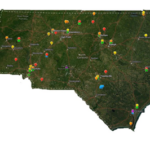 A satellite image of North Carolina is shown. There are pins on the map to show the locations of monitoring sites across the state.