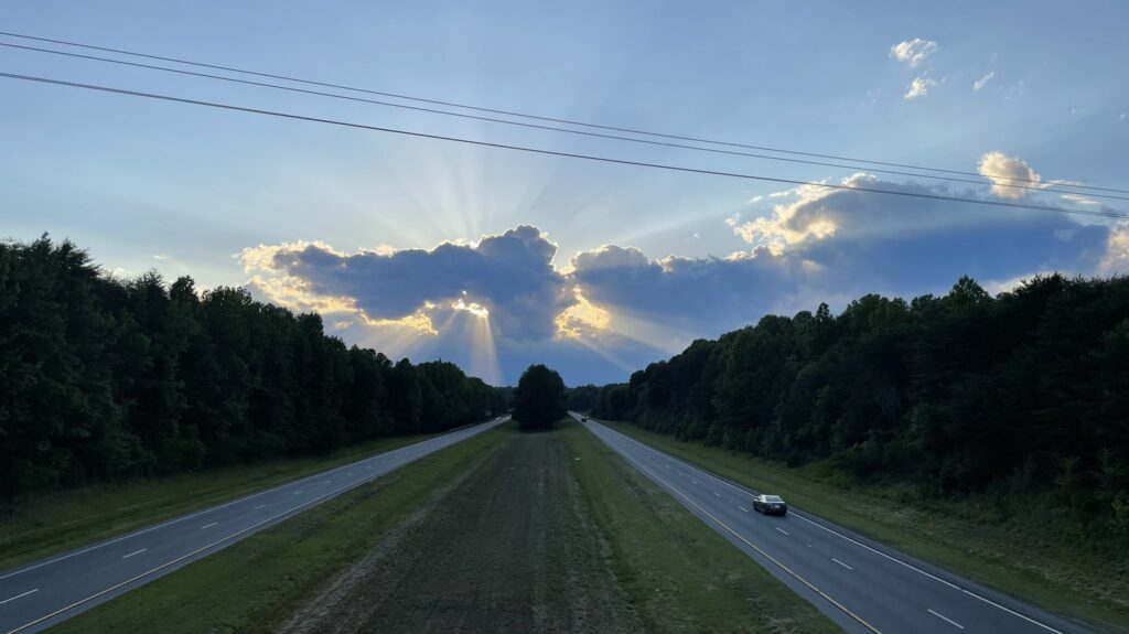The sun’s rays shine through the clouds in Surry County on May 27. 
